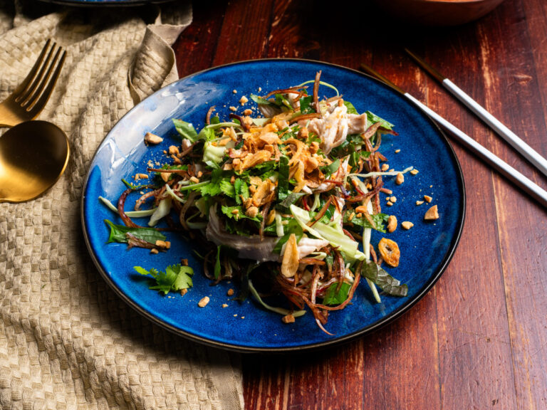 Vietnamese banana blossom salad with poached chicken, fresh herbs and fried shallots