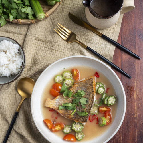 Canh chua Vietnamese sweet and sour soup with fish, okra and tomato in a bowl